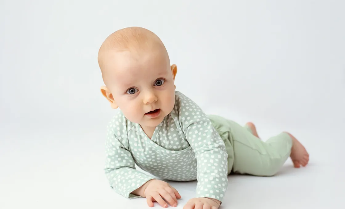 We maintaining a clean and safe production environment, meeting stringent standards throughout the Side Snap Bodysuit manufacturing process