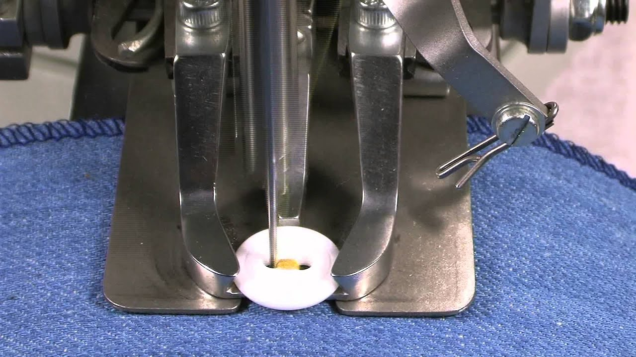 Button attaching machine