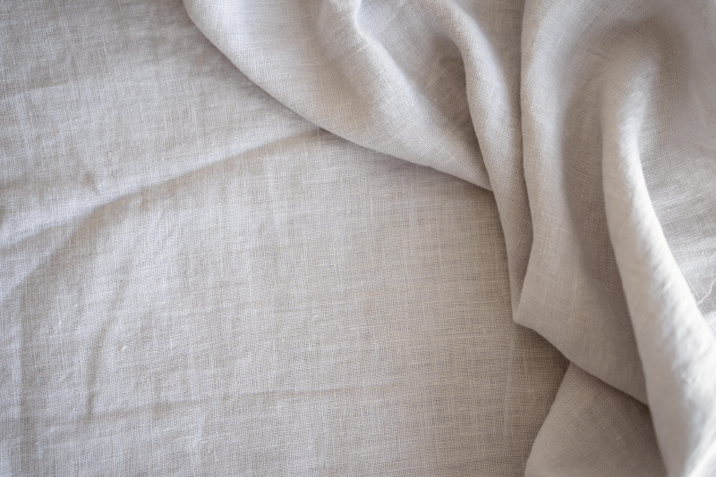 Linen is a natural fabric made from flax fibers, popular for summer clothes, casual wear, beachwear