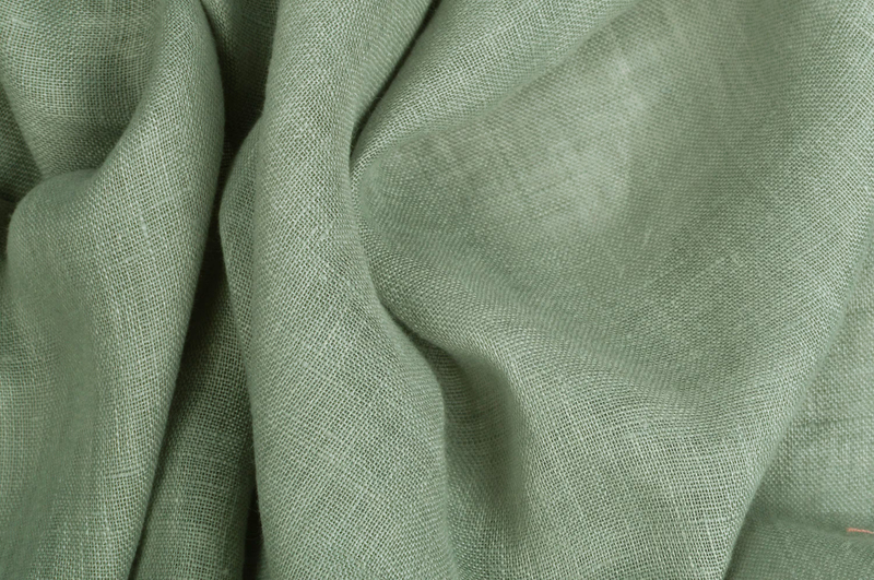 Linen is a natural textile made from flax fibers, known for its breathability, durability, and lightweight comfort