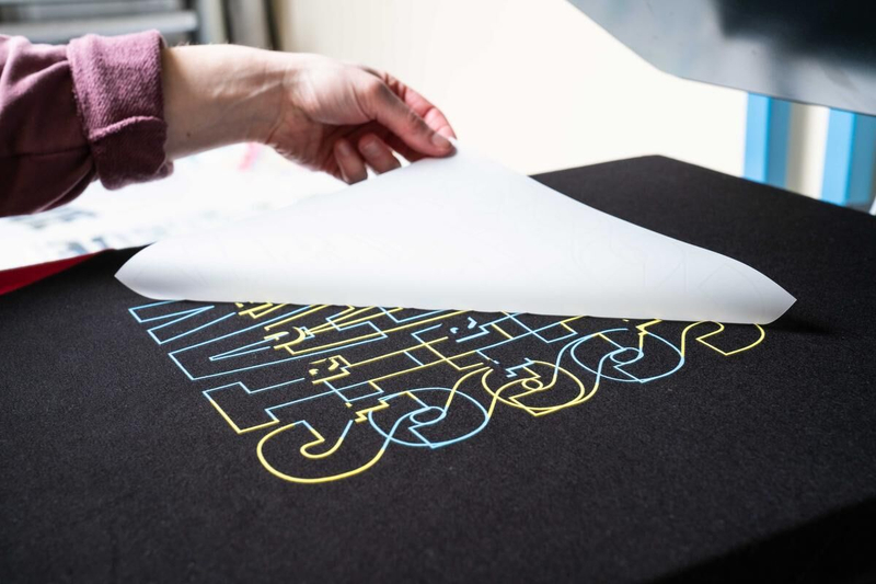 DTF printing is a versatile method that transfers designs from PET film to fabric using heat