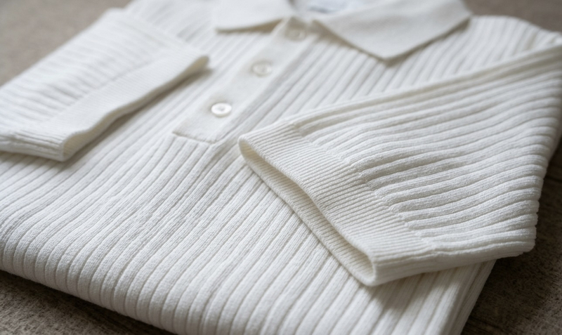 Ribbed sleeve polos feature elastic cuffs that improve durability, maintain shape, and create a more structured athletic look