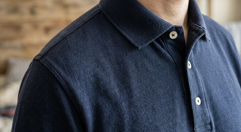 Unlike formal dress shirts, polo collars are knitted to turn down smoothly without requiring a separate collar stand