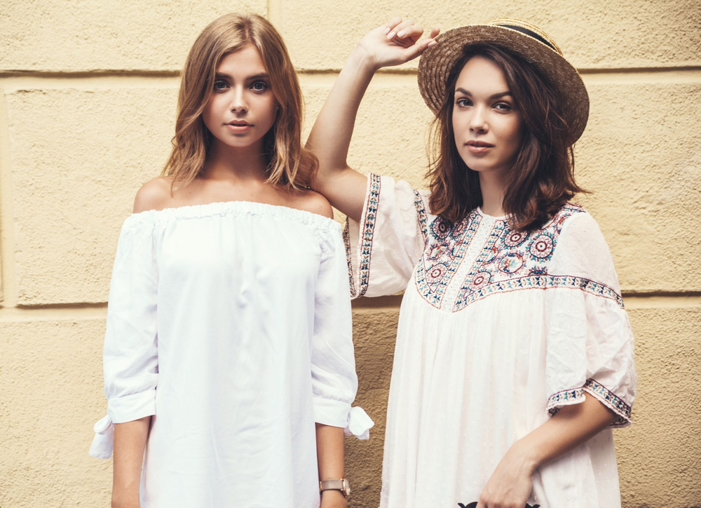 A loose, flowing summer kaftan top with integrated sleeves, crafted from breathable fabrics like cotton or silk for airy resortwear and versatile styling.
