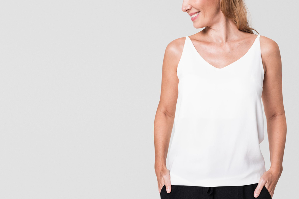 The camisole is an elegant, thin-strapped top crafted from versatile fabrics with customizable design details, perfect for both loungewear and refined layering